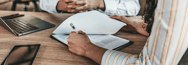 woman signing contract